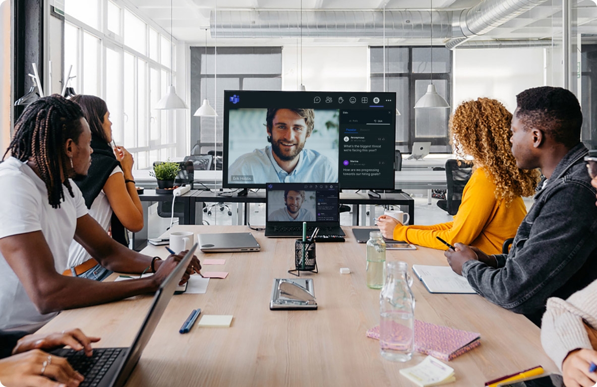 Group of people in conference room having remote meeting